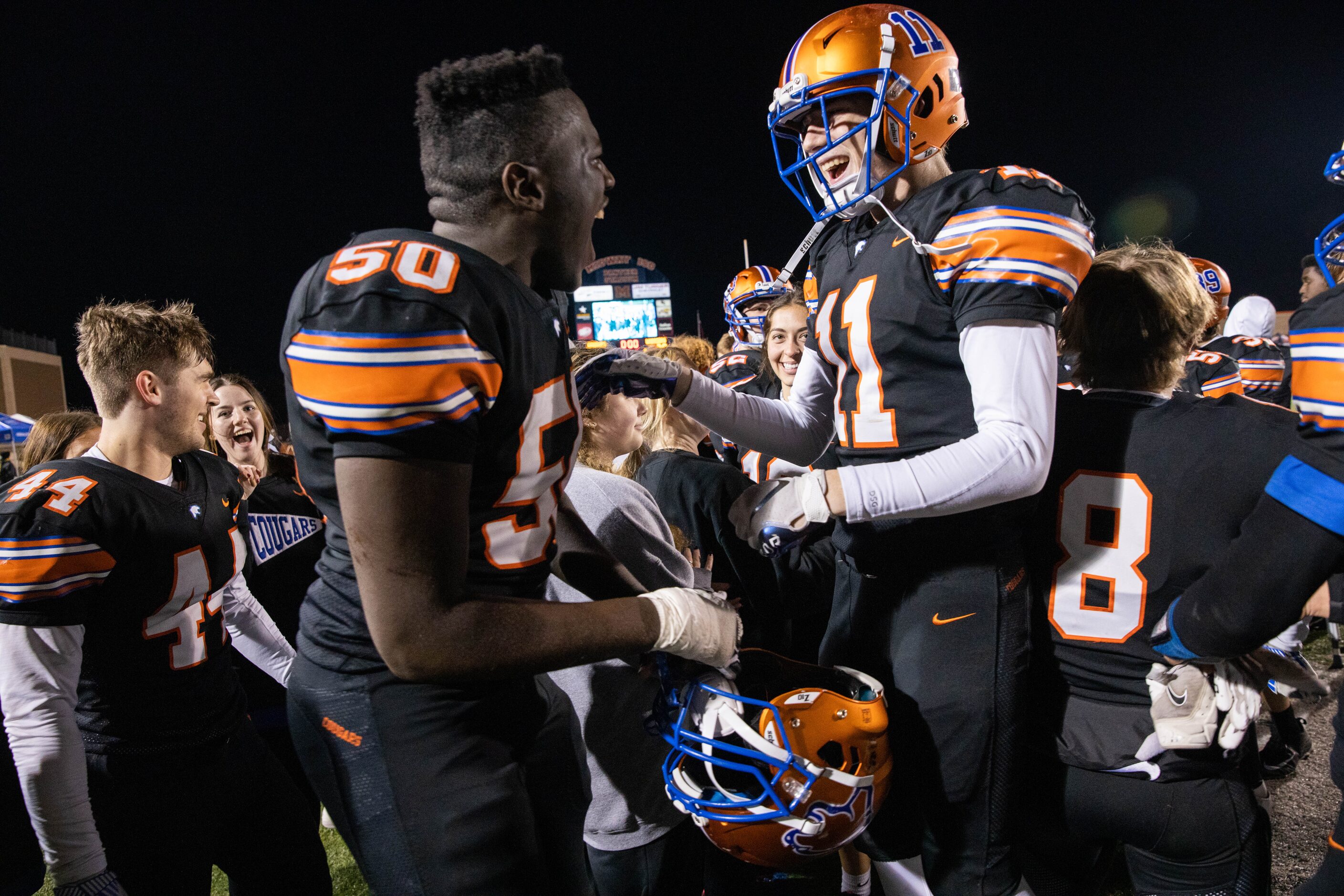 Colleyville Covenant's Nathan Kaja (50) and Jackson Britton (11) coaches celebrate winning...