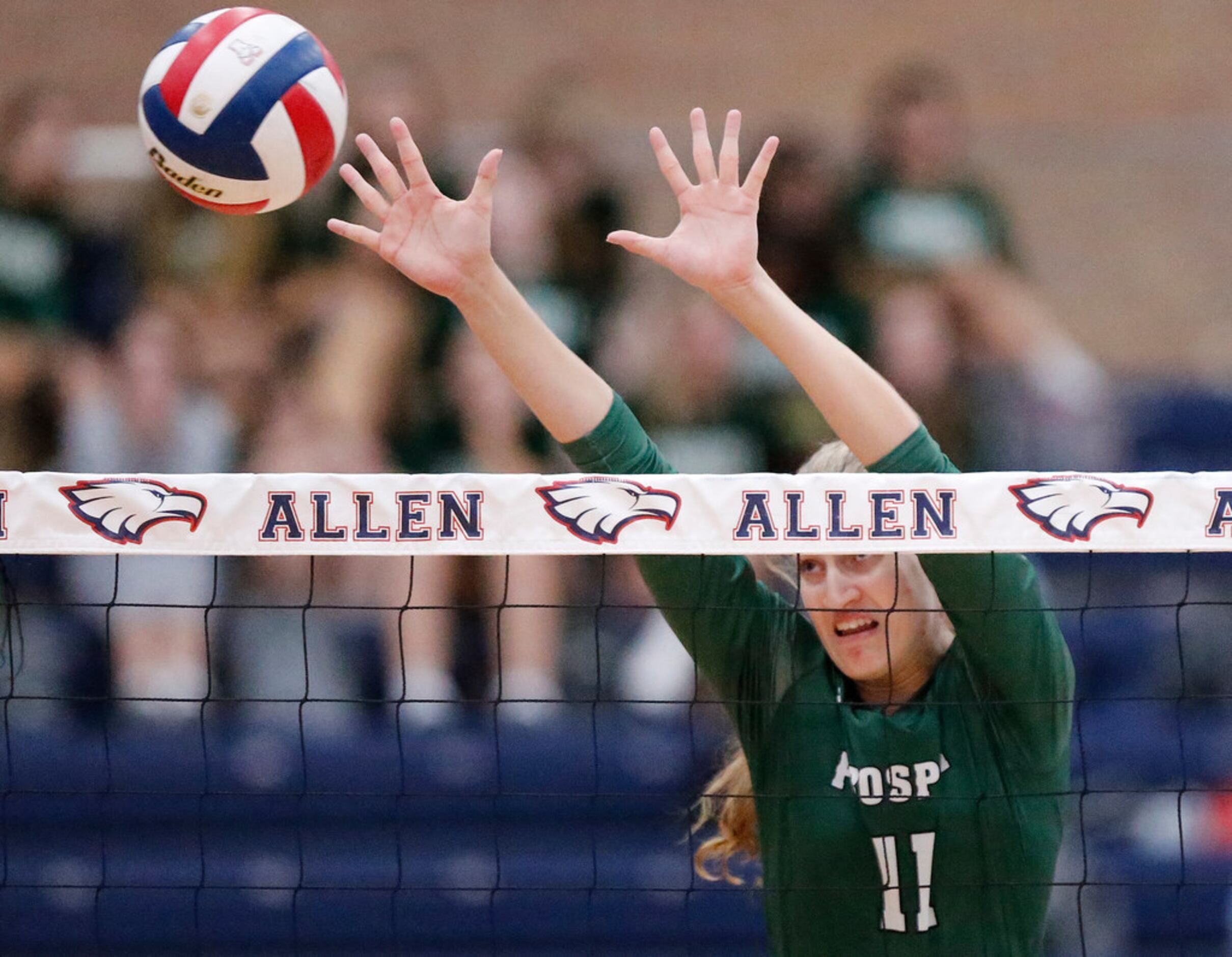 Prosper High School middle blocker Shaylee Shore (11) attempts a block during game three as...