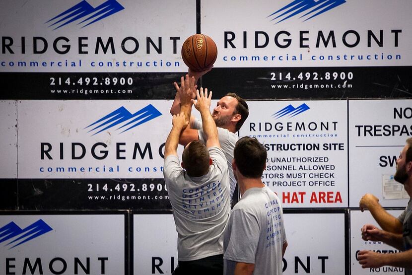 Joey Johnson takes a shot during a regular Wednesday game at Ridgemont including employees,...
