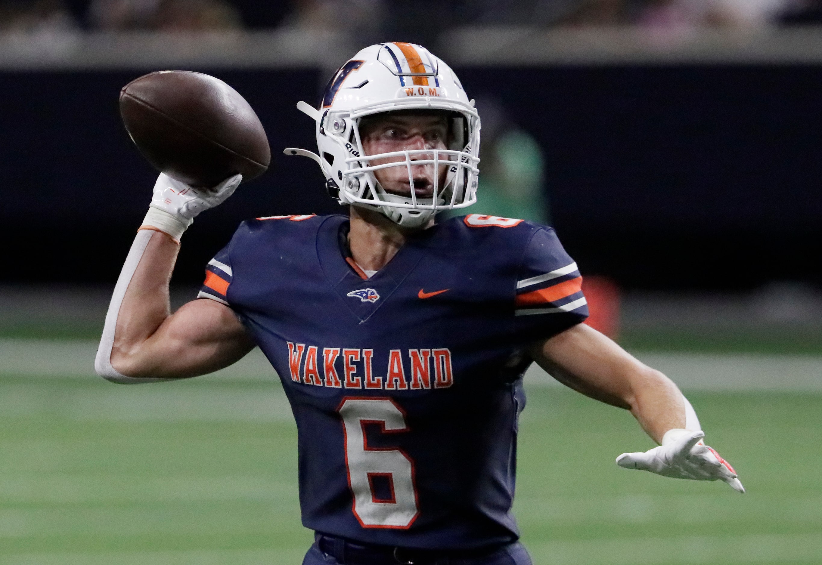 Wakeland High School wide receiver Grayson Myer (6) throws an option pass for a touchdown...