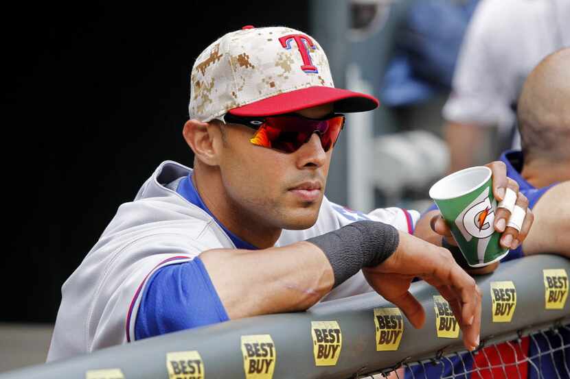 May 26, 2014; Minneapolis, MN, USA; Texas Rangers right fielder Alex Rios (51) wears a...