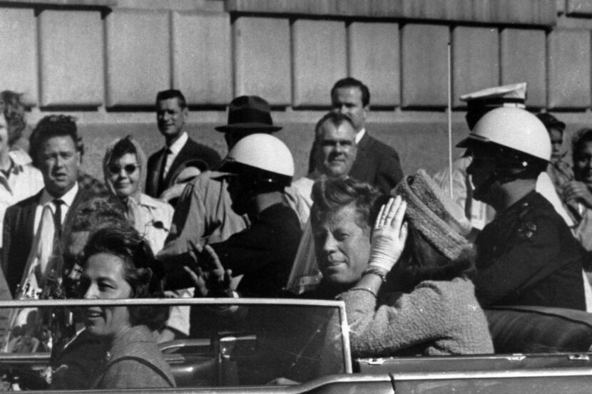 FILE - This Nov. 22, 1963 file photo shows President John F. Kennedy riding in motorcade...
