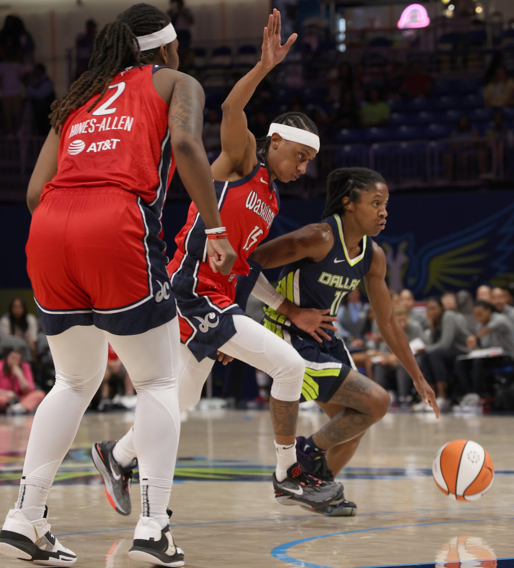 Dallas Wings guard Crystal dangerfield (11) drives around the defense of Washington Mystics...