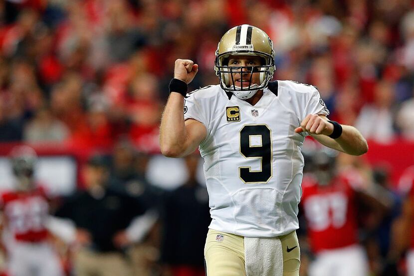 ATLANTA, GA - JANUARY 03:  Drew Brees #9 of the New Orleans Saints celebrates a touchdown...