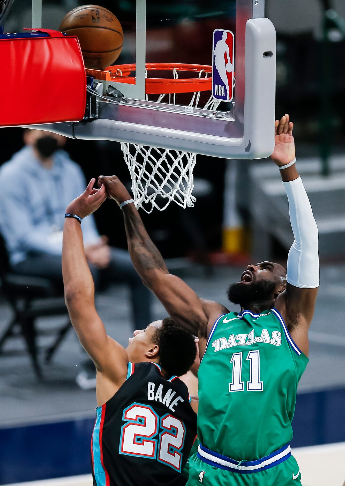 Dallas Mavericks forward Tim Hardaway Jr. (11) attempts a lay up as Memphis Grizzlies guard...