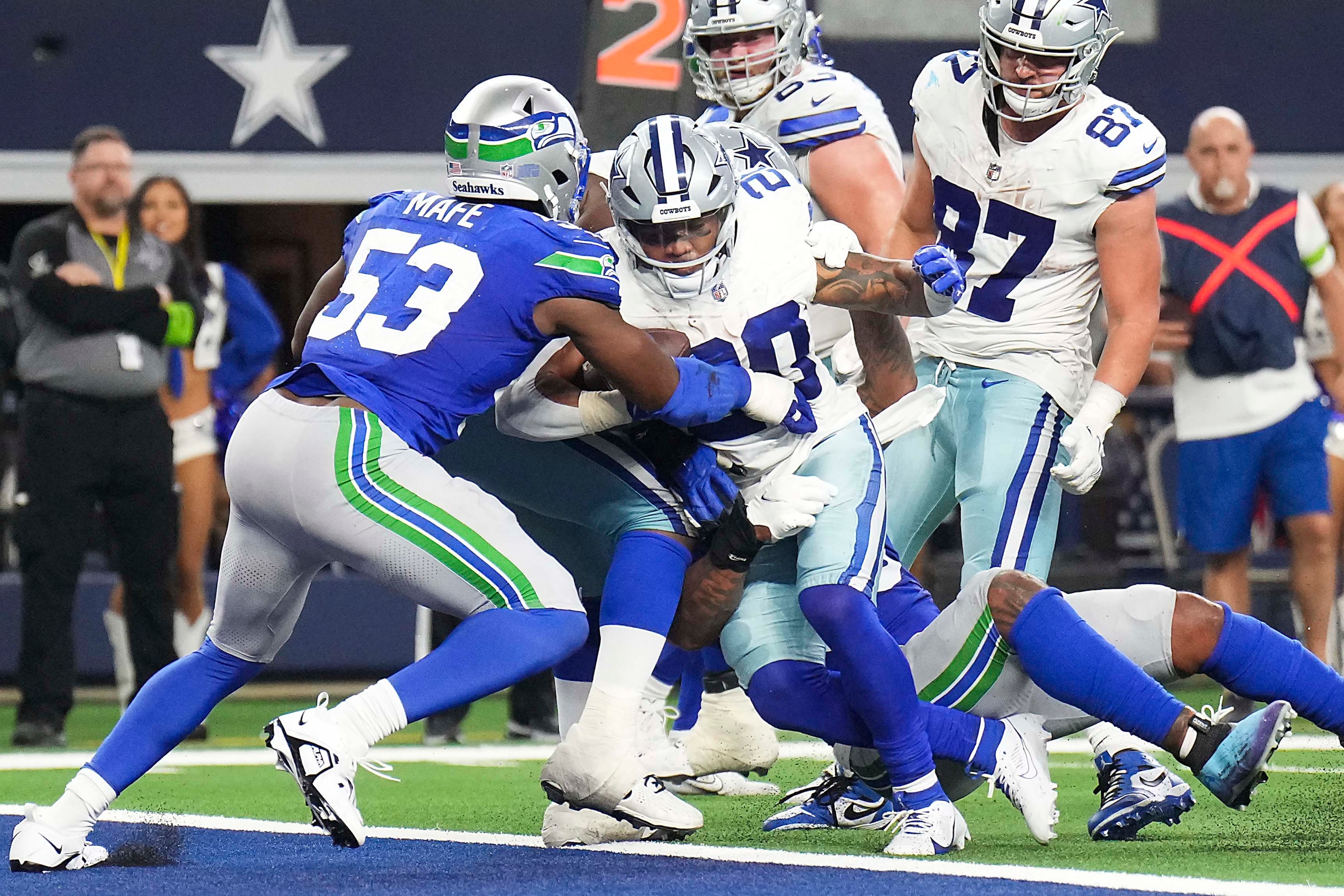 Dallas Cowboys running back Tony Pollard (20) pushes in to the end zone for a touchdown...