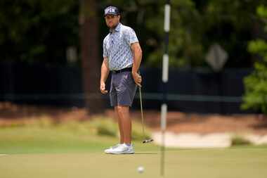 Colin Prater watches his putt on the first hole during a practice round for the U.S. Open...