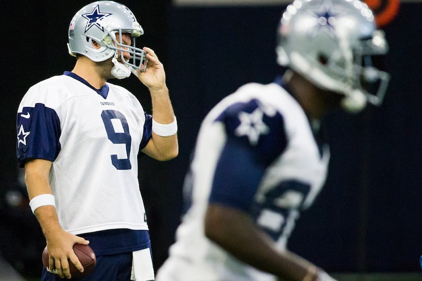 Dallas Cowboys quarterback Tony Romo (9) adjusts his helmet during the team's practice at...
