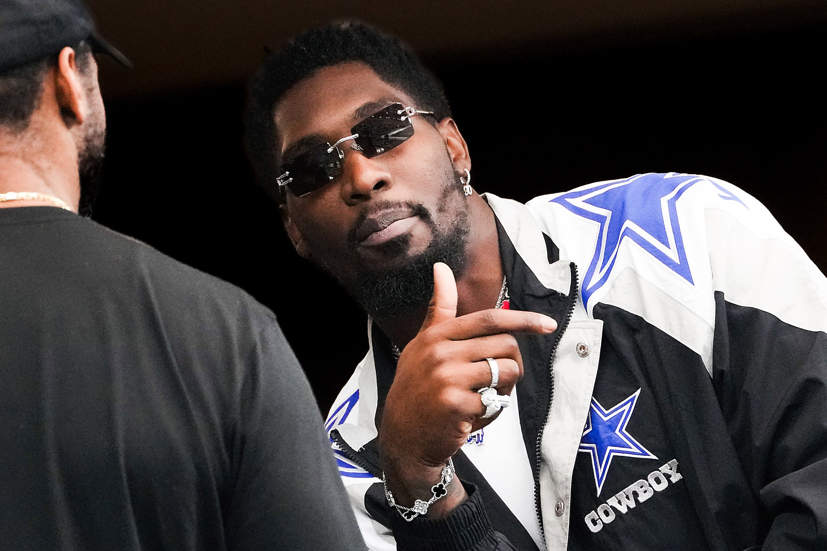 Dallas Cowboys defensive end DeMarcus Lawrence watches from a suite during the first half of...