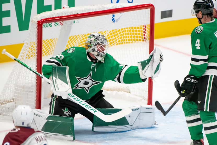 Dallas Stars goaltender Jake Oettinger (29) makes a save during the second period of a...