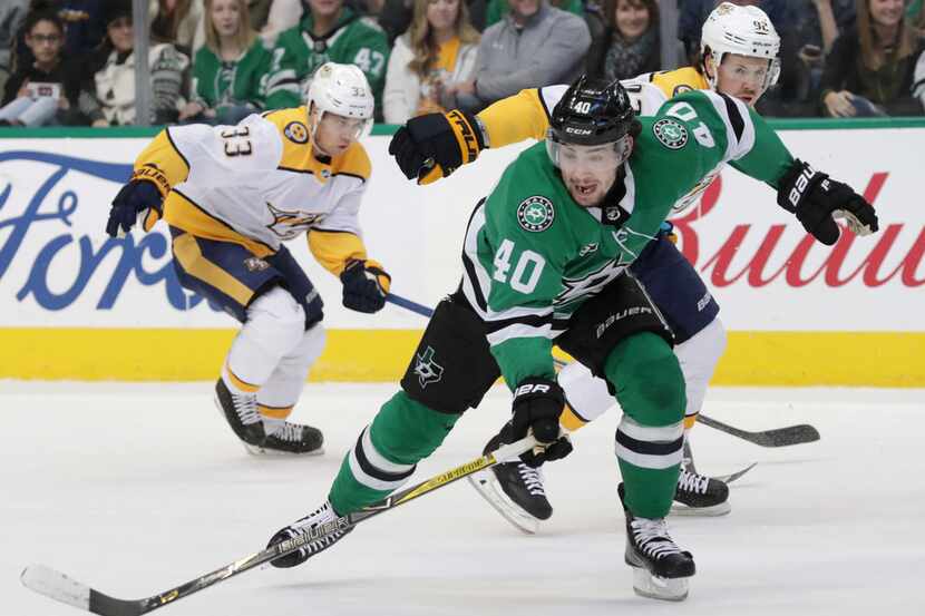 Dallas Stars left wing Remi Elie (40) chases the puck in front of Nashville Predators center...