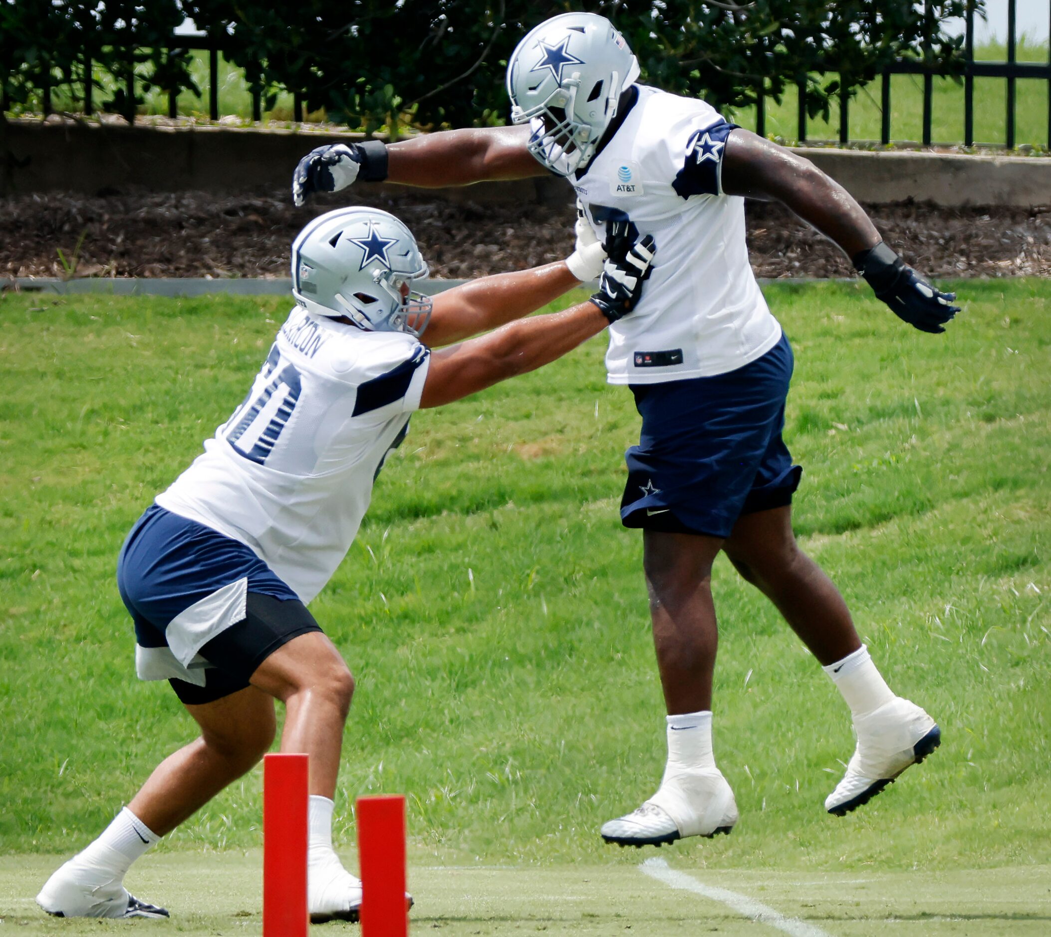 Dallas Cowboys offensive tackle Isaac Alarcon (60)  pushes on offensive tackle Tyler Smith...