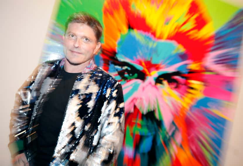 Kenny Goss, former partner of singer George Michael, photographed in front of a painting of...