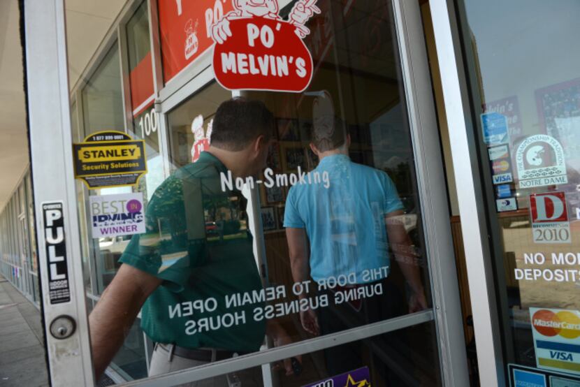 Patrons enter Po' Melvin's restaurant, which voluntarily went smoke-free in January. The...