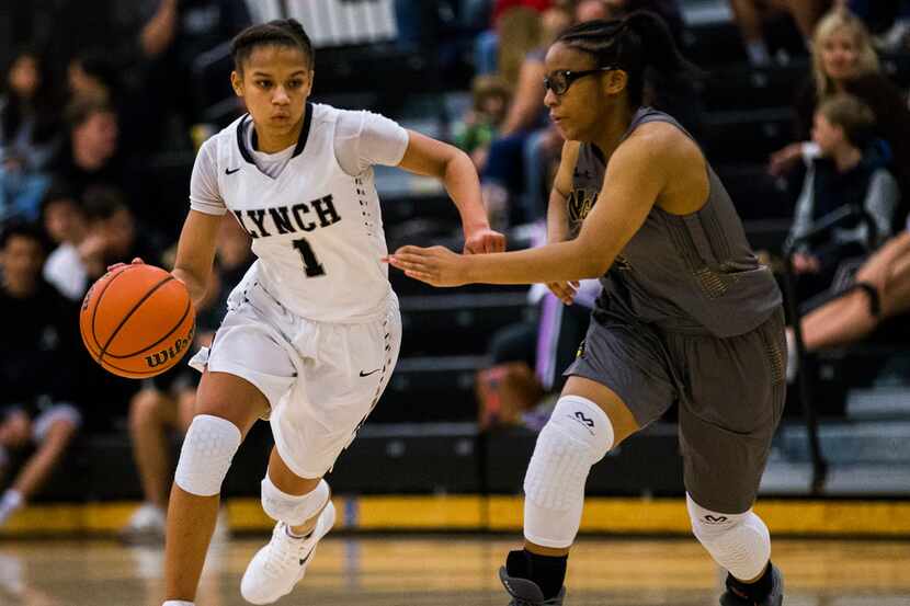 Bishop Lynch's Endyia Rogers (1) makes her way down the court with McKinney's Erin Jackson...