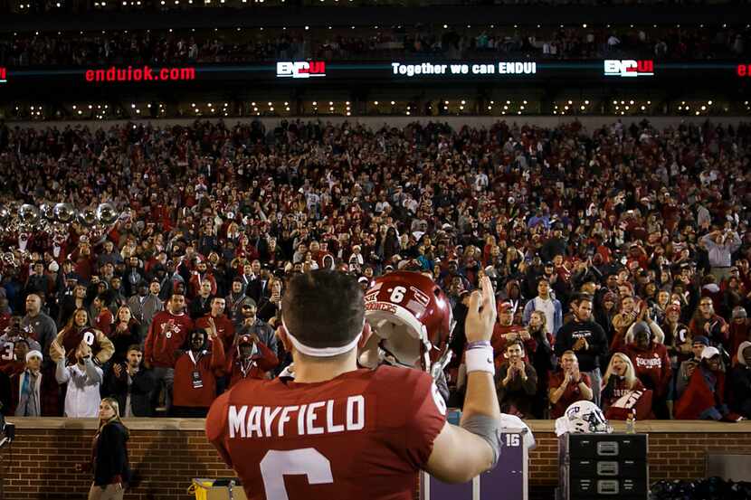 Oklahoma quarterback Baker Mayfield salutes the home crowd after the Sooners 38-20 victory...