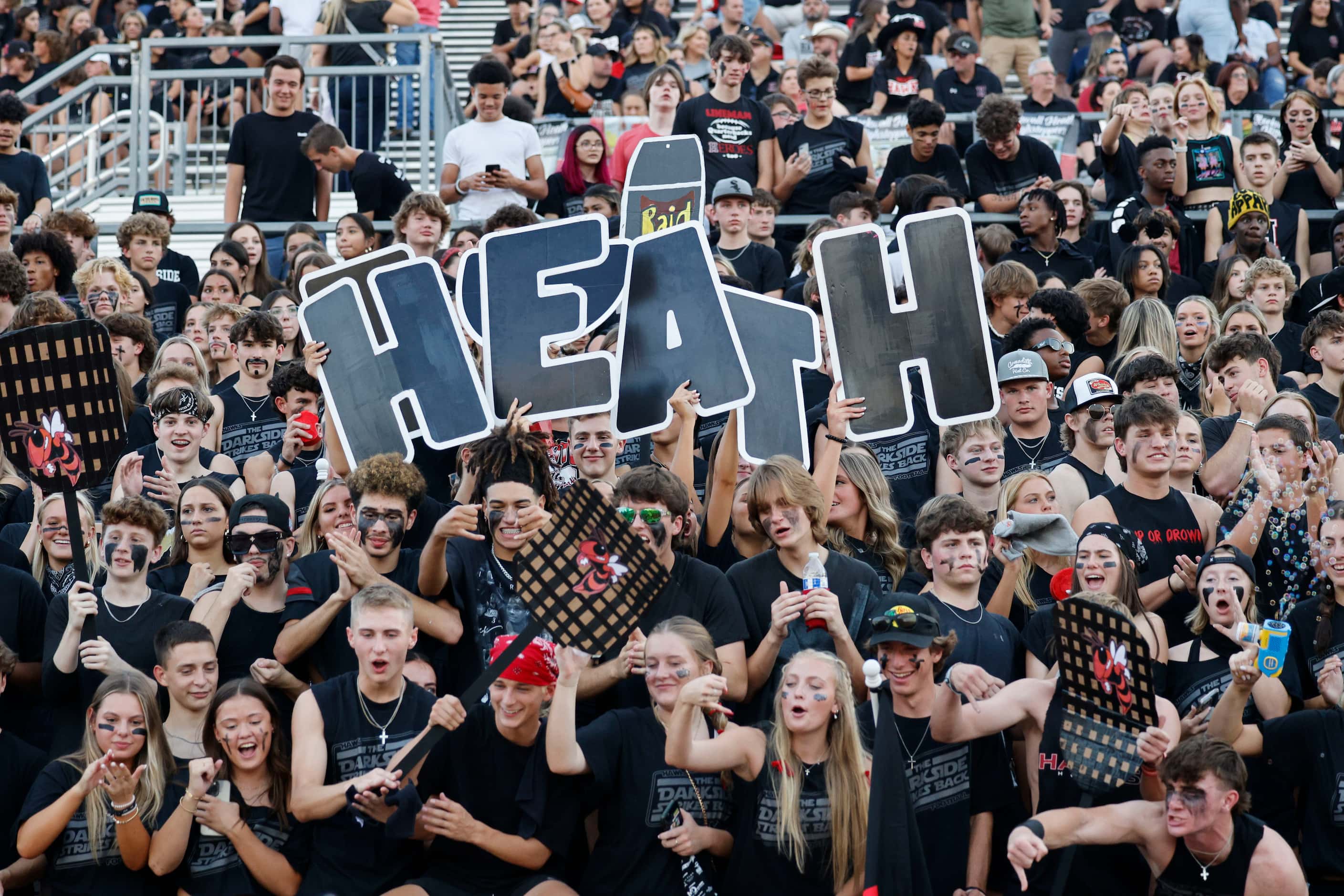 Rockwall-Heath fans cheer before the first half of a high school football game against...