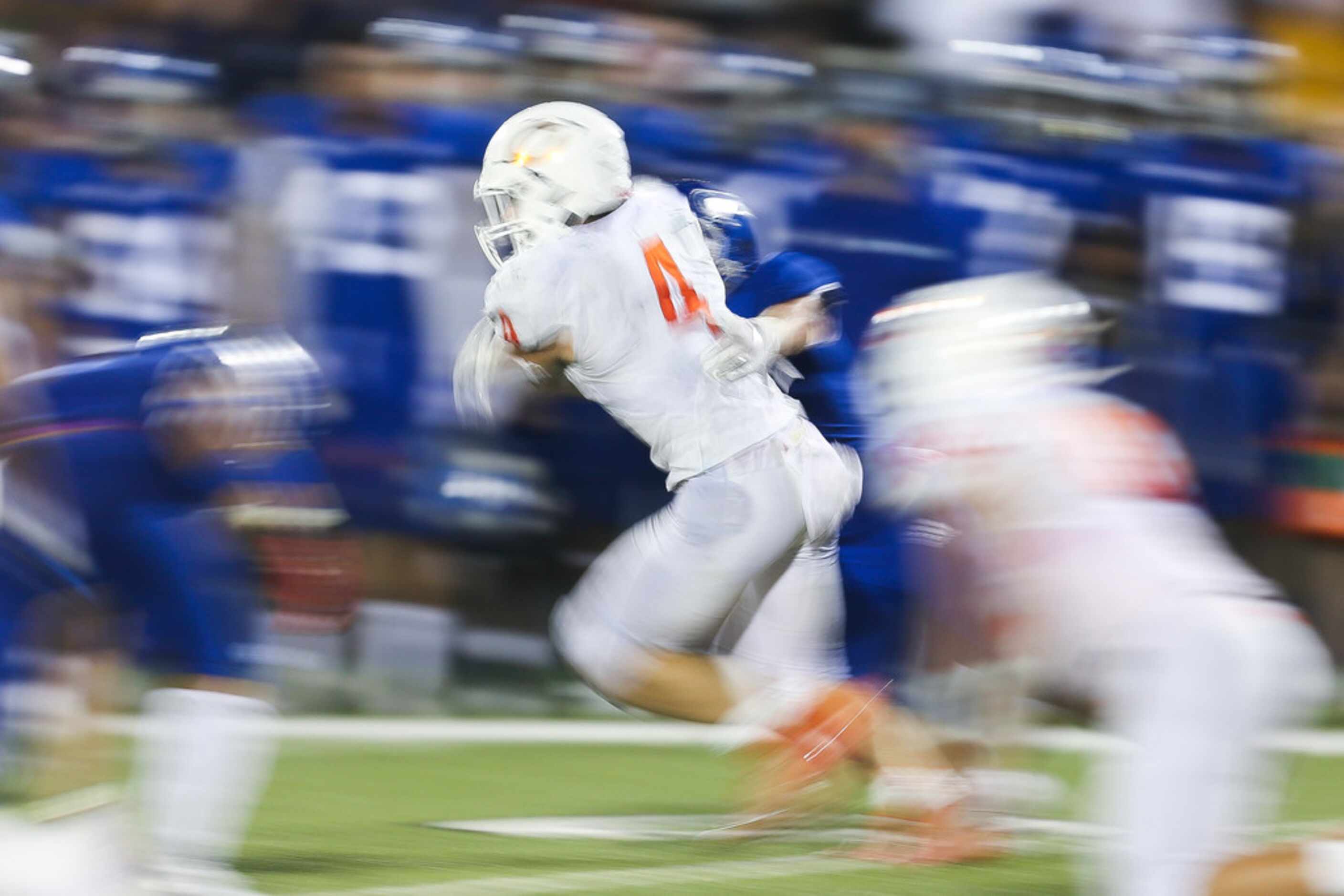 Celina running back Logan Point (4) carries the ball during a high schools football game at...