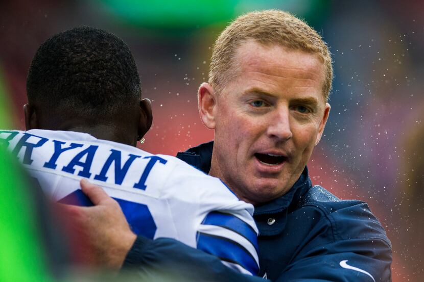 Dallas Cowboys wide receiver Dez Bryant (88) hugs Dallas Cowboys head coach Jason Garrett...