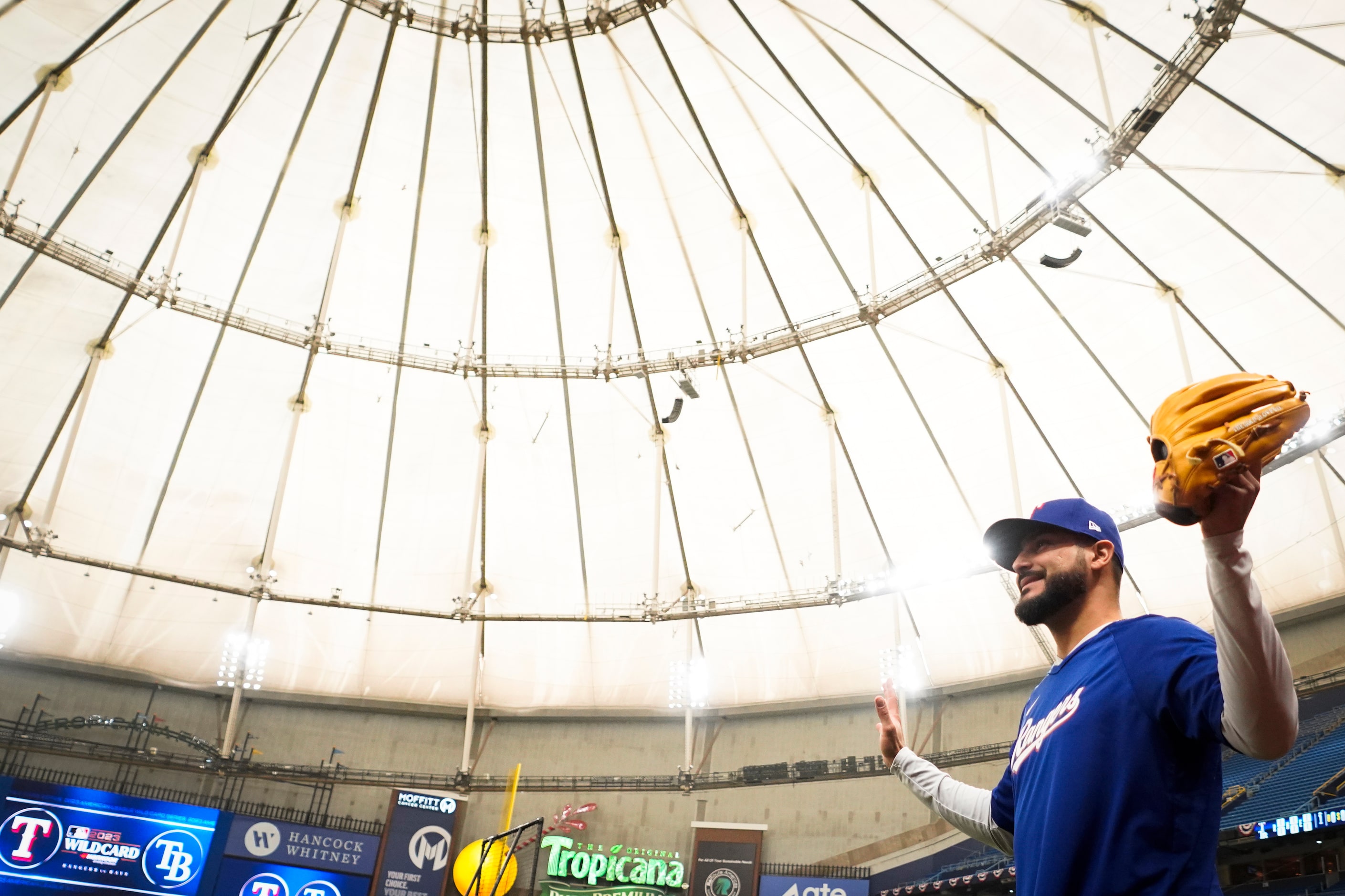 Texas Rangers starting pitcher Martin Perez takes the field to warm up before an  American...