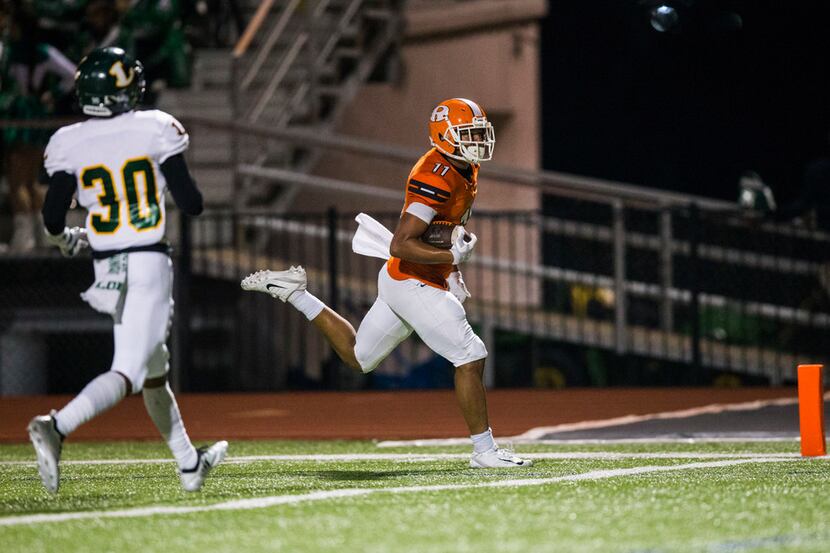 Rockwall wide receiver Jaxon Smith (11) runs to the end zone for a touchdown ahead of...