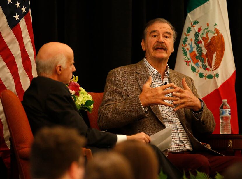 Former Mexican President Vicente Fox, right, speaks during the World Affairs Council's...