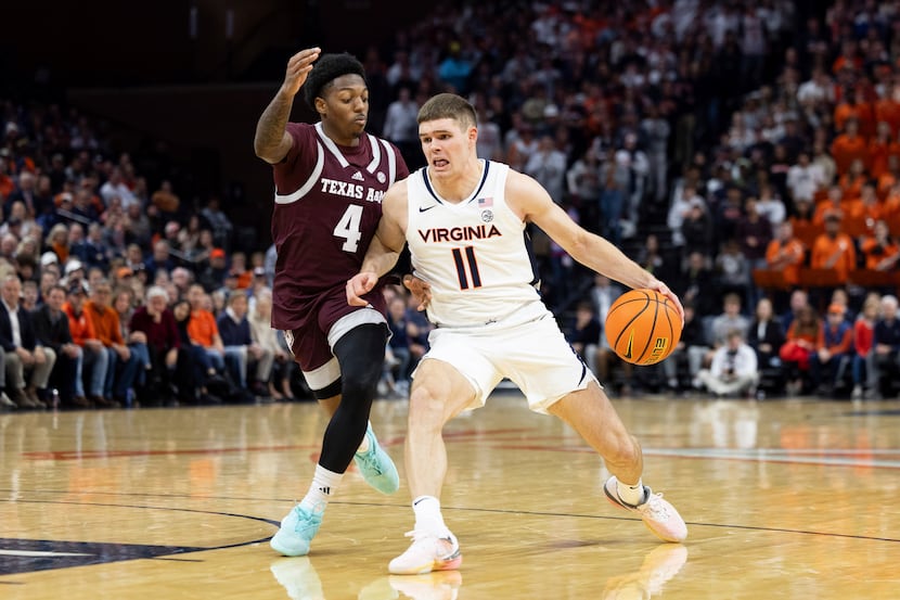 Virginia's Isaac McKneely (11) drives with the ball defended by Texas A&M's Wade Taylor IV...