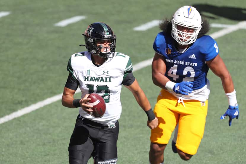 San Jose State defensive end Viliami Fehoko (42) chases Hawaii quarterback Chevan Cordeiro...