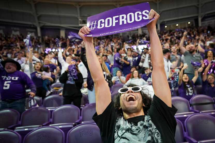 TCU fan Alejandro Ramirez celebrates after a Horned Frogs first quarter touchdown during a...