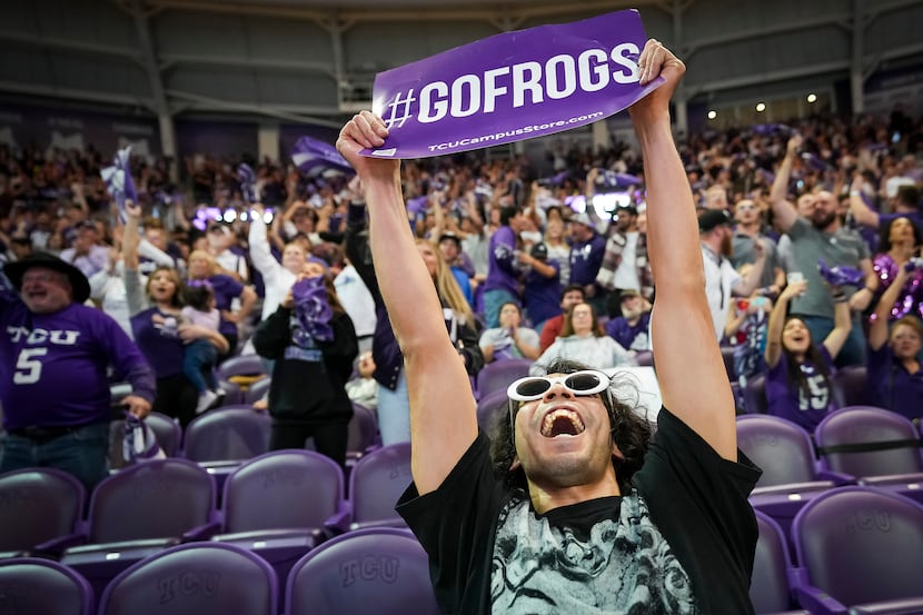 TCU fan Alejandro Ramirez celebrates after a Horned Frogs first quarter touchdown during a...