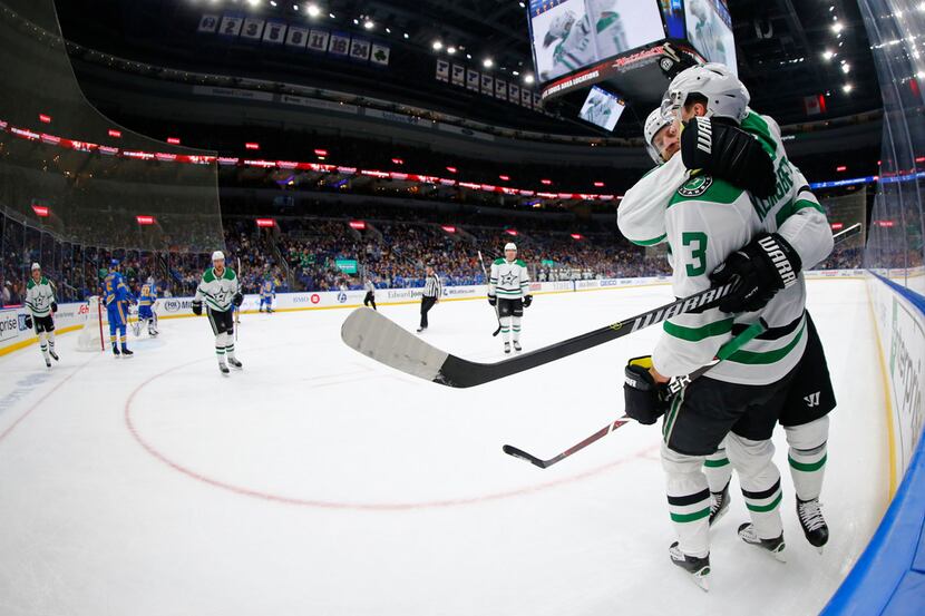 Dallas Stars' John Klingberg (3) is congratulated by a teammate after scoring a goal against...