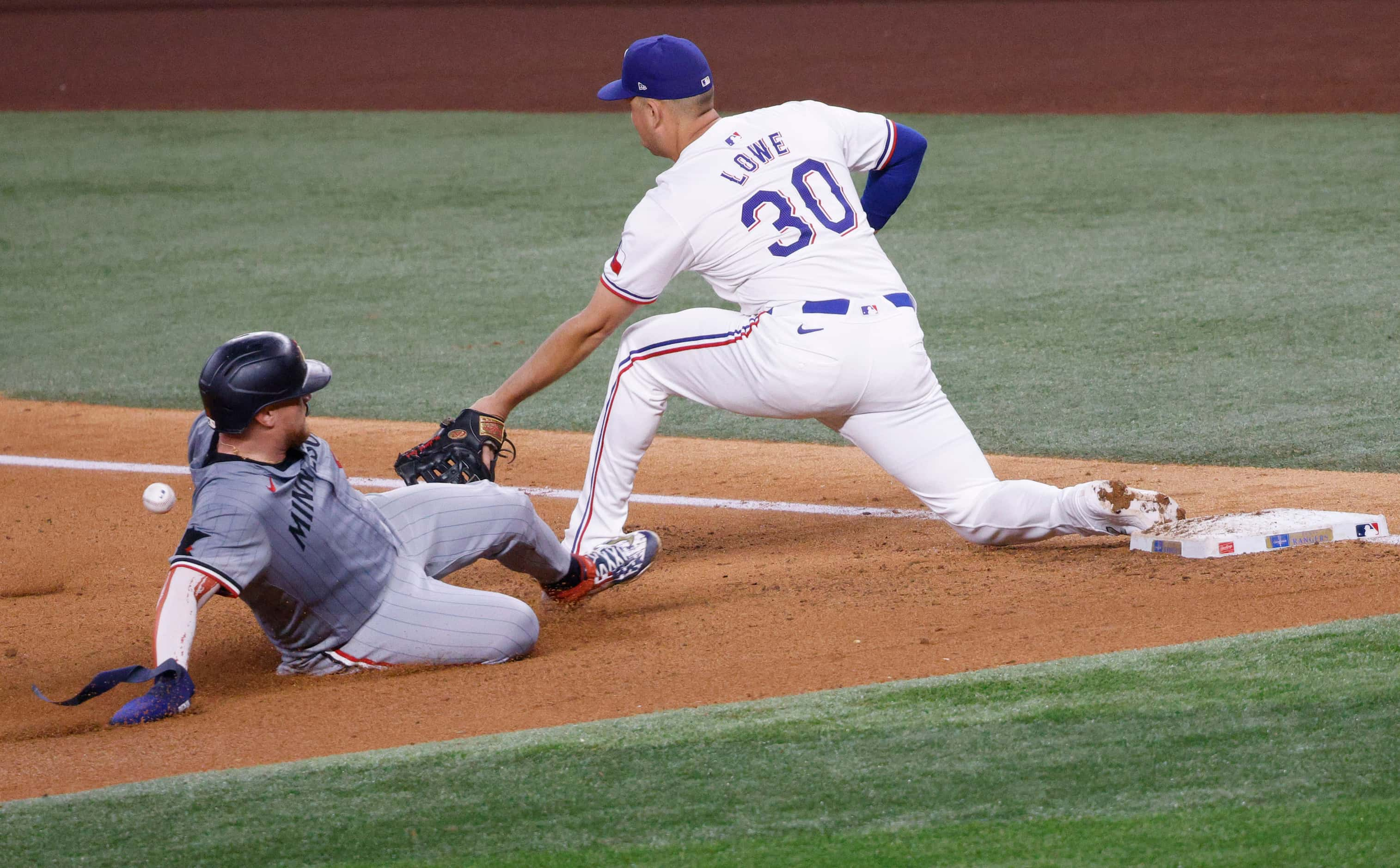 Minnesota Twins catcher Christian Vázquez (8) is thrown out as Texas Rangers first base...