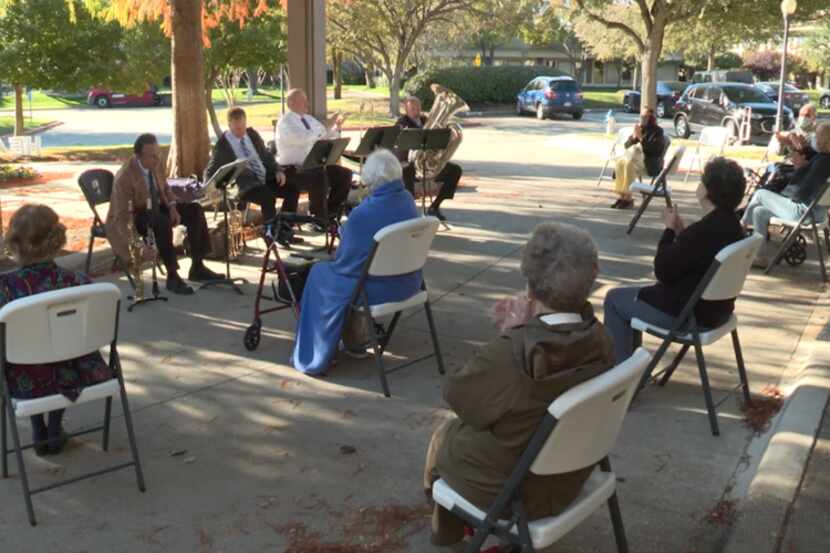 Members of the Texas Winds musical outreach are shown entertaining elderly Richardson...