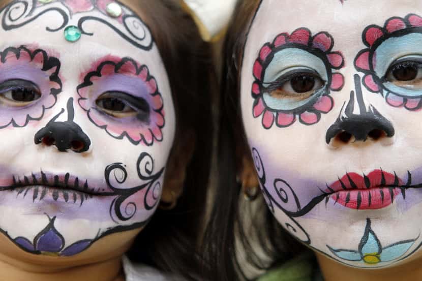 Sisters Cristal Ortega, 4 (left), and her sister Kenya Ortega, 7, show off their day of the...