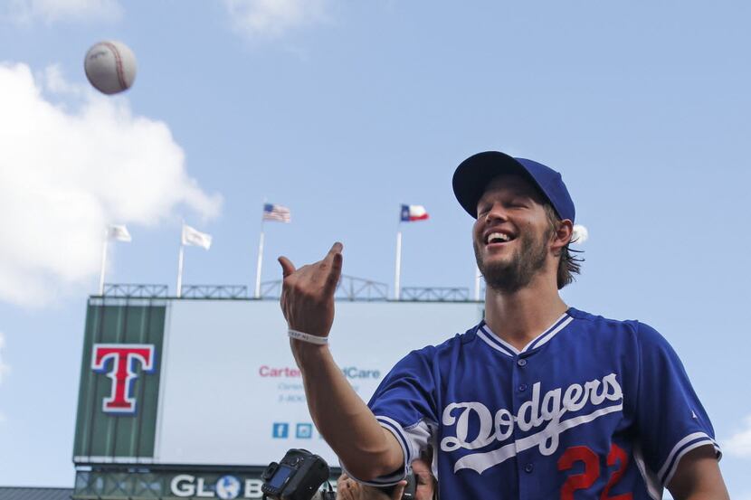 Los Angeles Dodgers pitcher Clayton Kershaw signs autographs before the Los Angeles Dodgers...