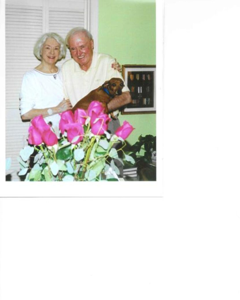 
Dennis King stands with his wife, Patricia Halford, and their dog, Winston.
