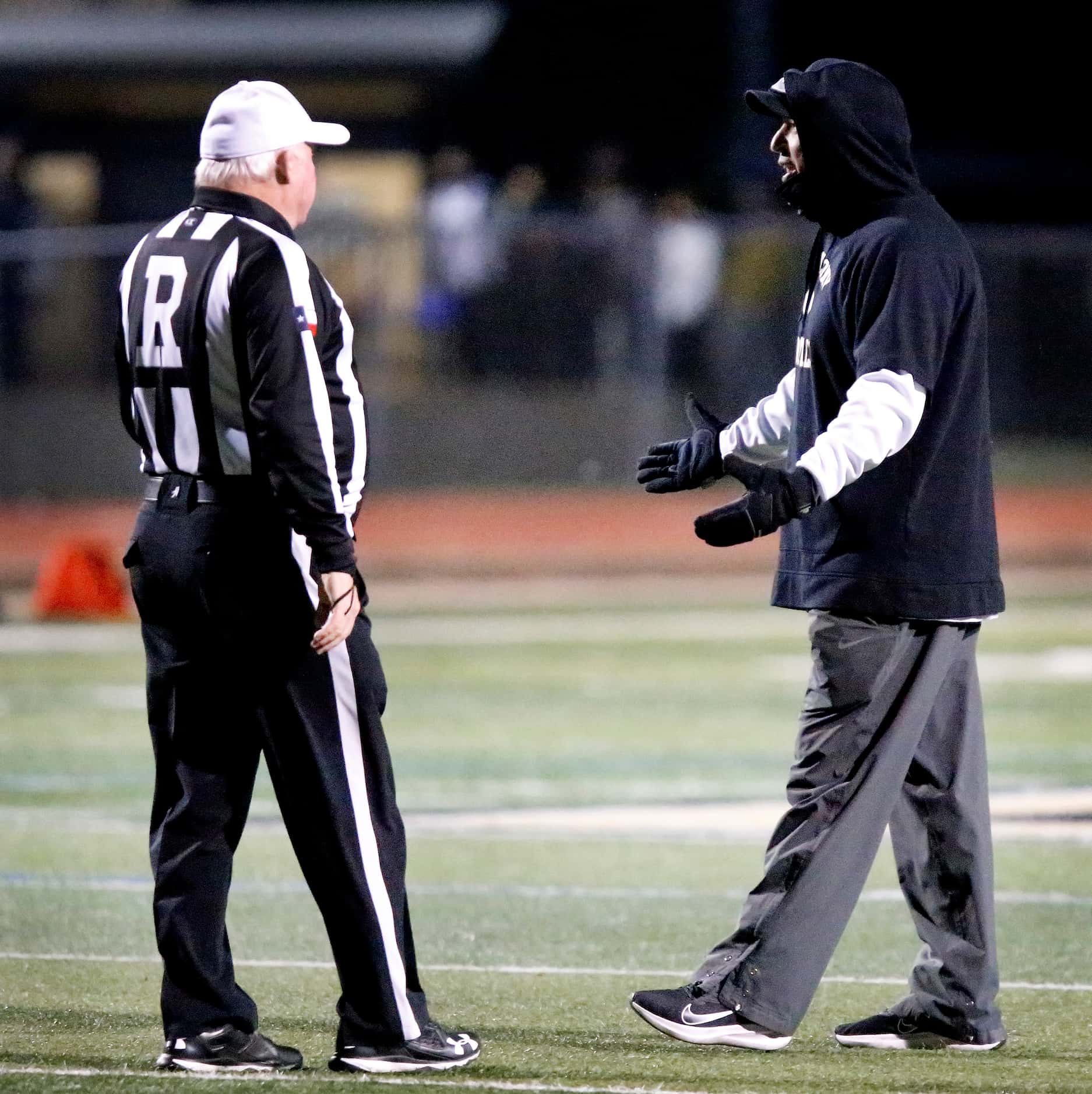 The Colony High School head coach Rudy Rangel questions a call which cancelled a touchdown...
