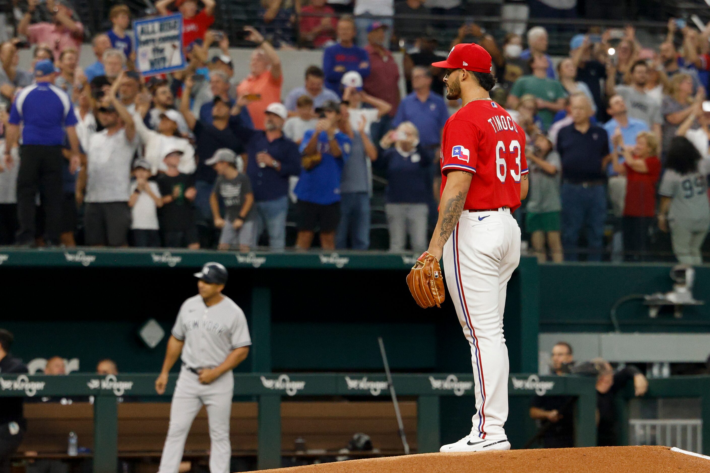 Texas Rangers relief pitcher Jesus Tinoco (63) watches as New York Yankees right fielder...