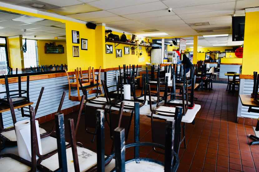 The dining area inside Tacos la Banqueta taqueria in East Dallas is closed to comply with...
