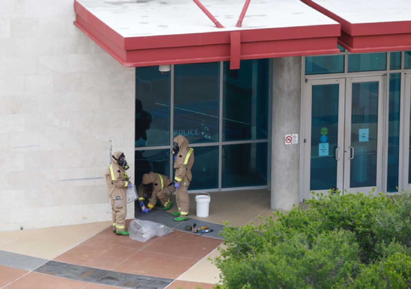 Police officers and firefighters respond to  a suspicious package was found near the north...
