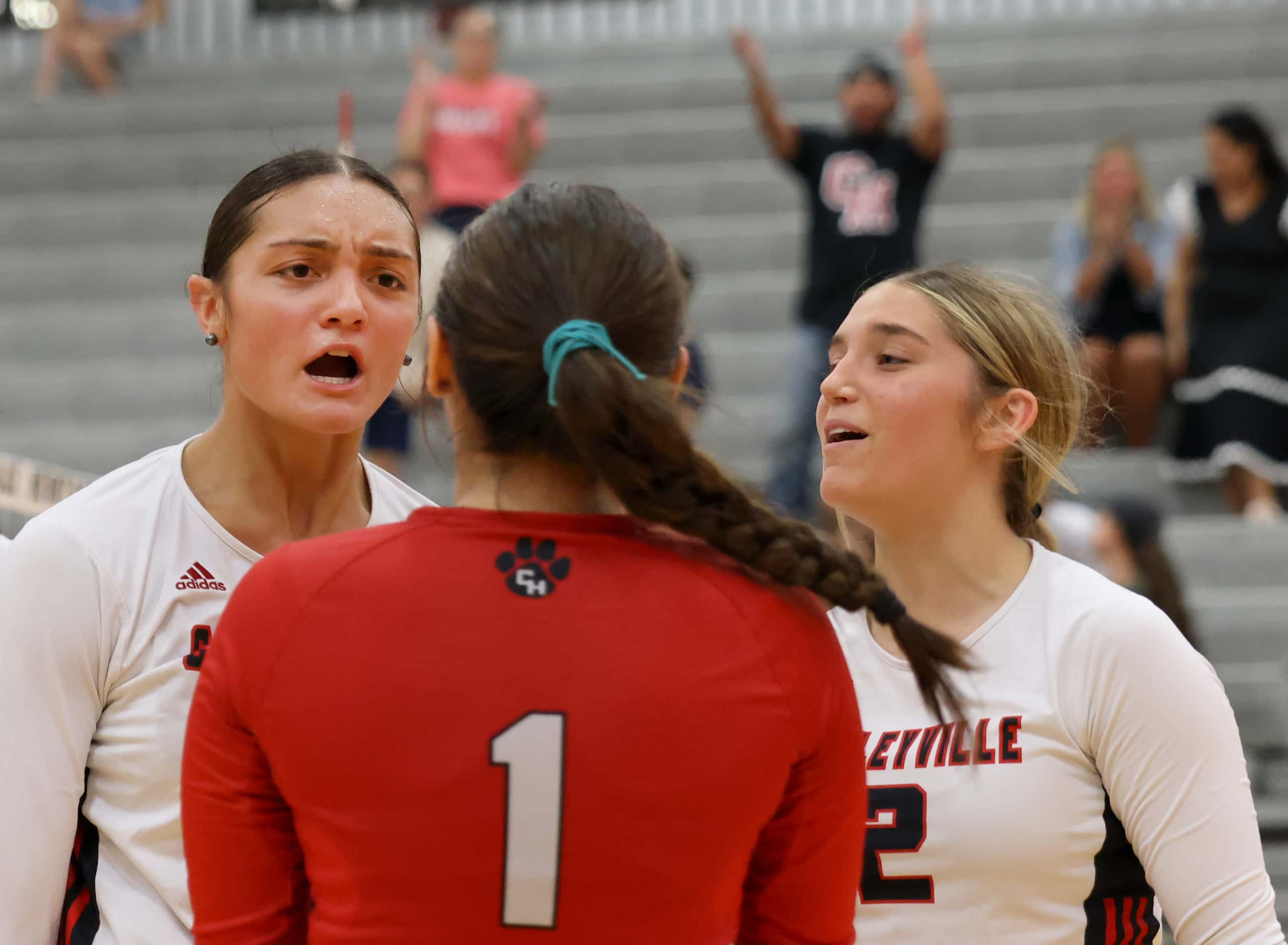 Colleyville Heritage players Suli Davis (11), left, and Audrey Popp (2), right, react with...