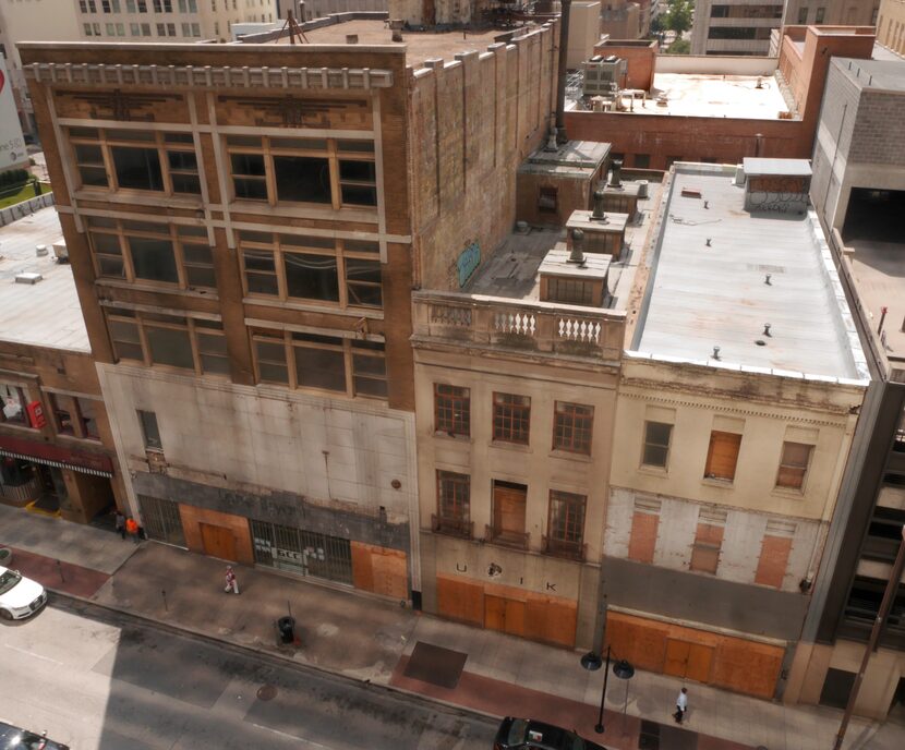 The three Elm Street buildings date from the early 20th century.