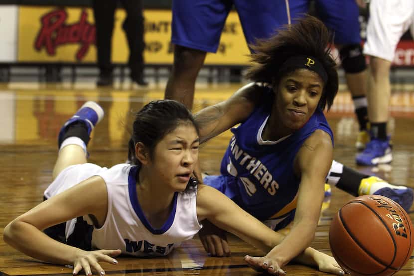 Plano West Wolves' Natalie Chou (24) scrambles for a loose ball against Pflugerville...
