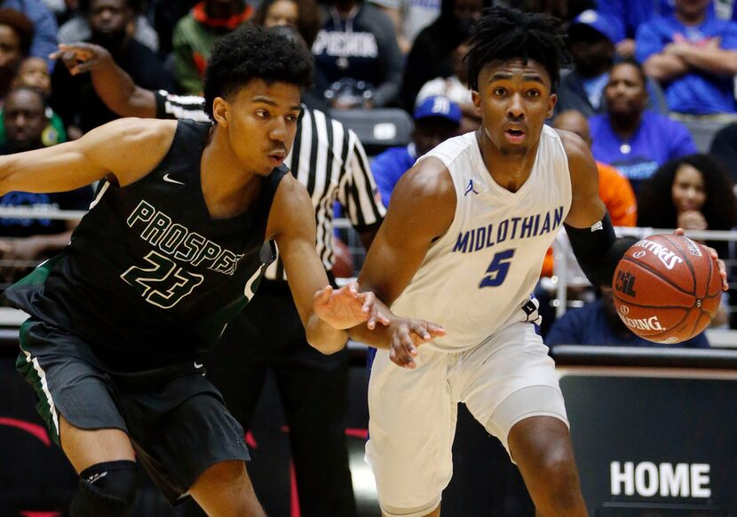 Prosper High guard Zachary Wrightsil (23) tries to cut of Midlothian High guard Kaden Archie...