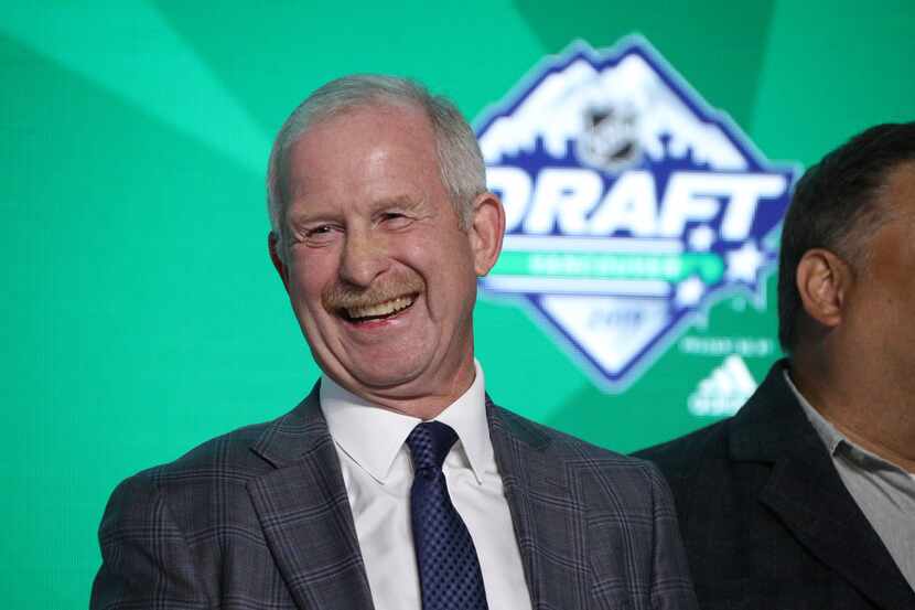 General Manager Jim Nill of the Dallas Stars stands onstage during the first round of the...