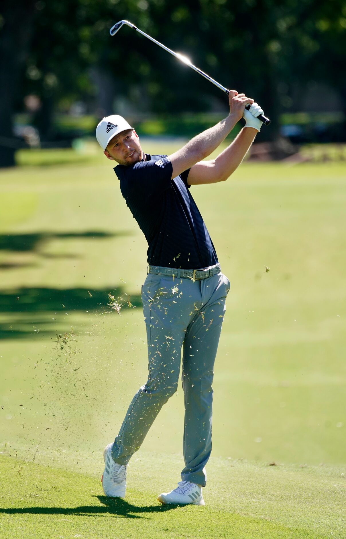 PGA Tour golfer Jordan Spieth splashes his ball out of the greenside bunker on No. 2 during...