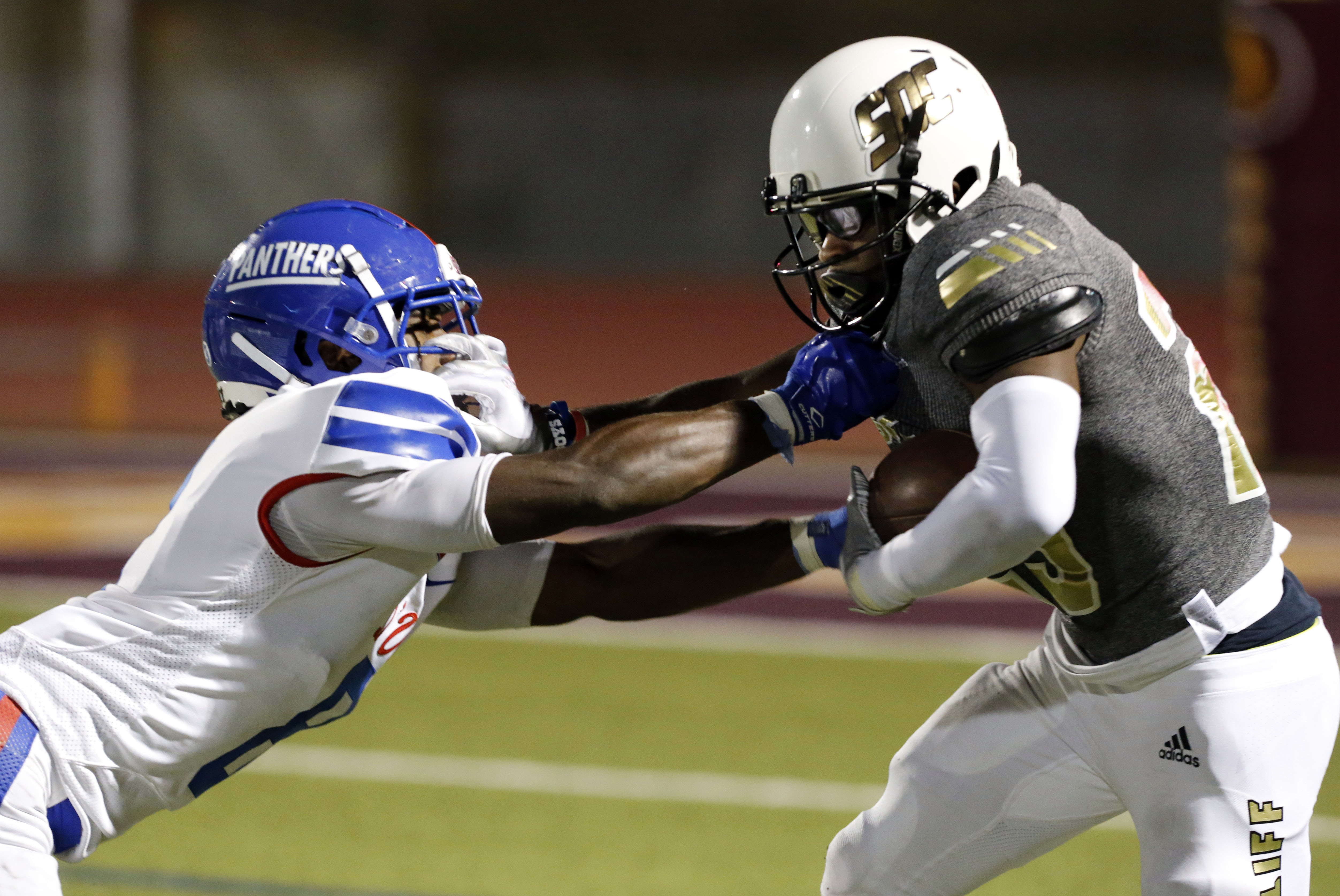 Duncanville’s Jadarius Thursby (8) tackles South Oak Cliff RB Cameron Davis (25) during the...