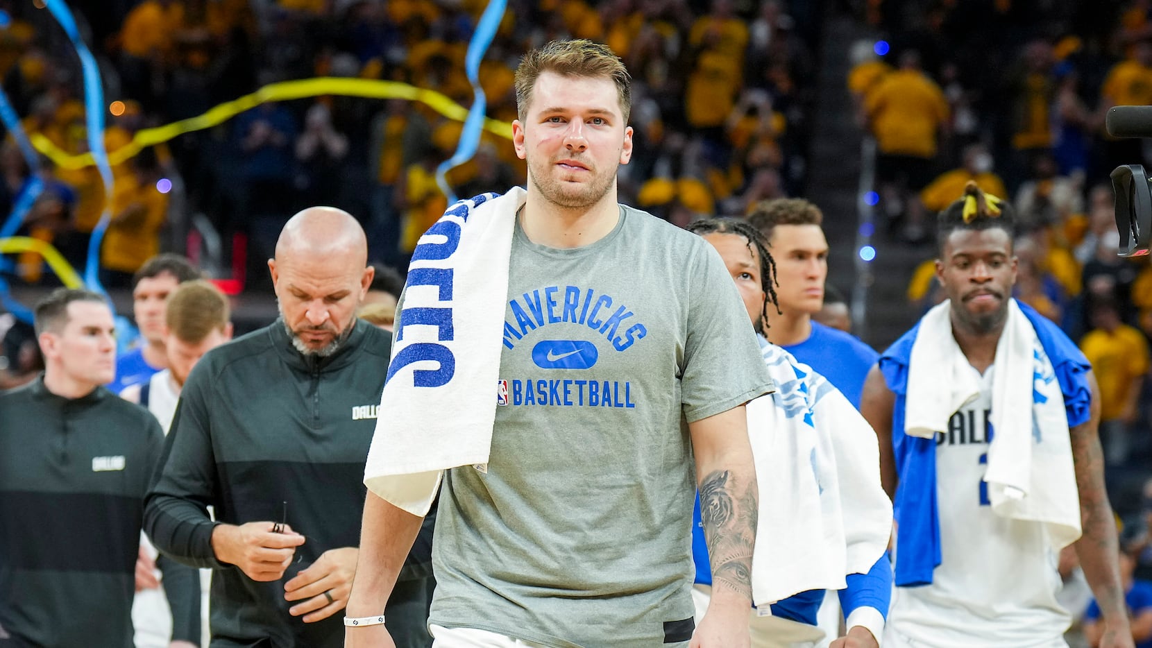 Dallas Mavericks guard Luka Doncic leaves the court after a loss to the Golden State...