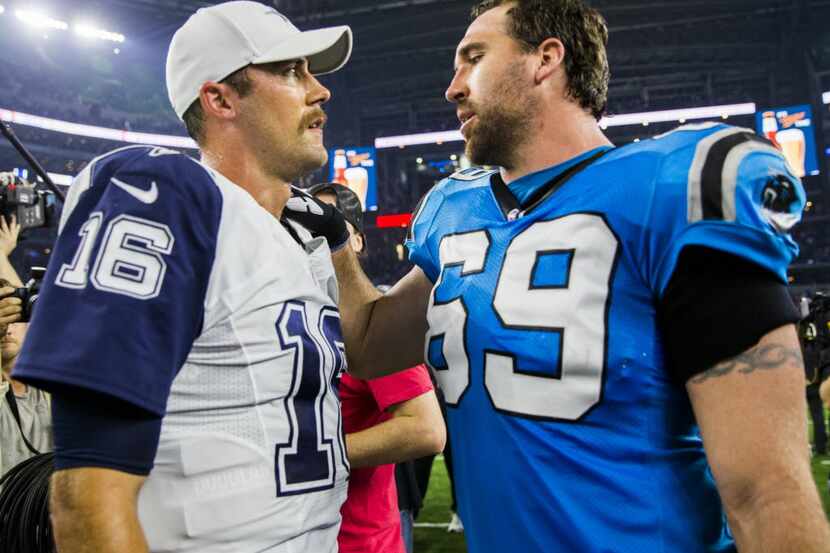 Dallas Cowboys quarterback Matt Cassel (16) talks to Carolina Panthers defensive end Jared...