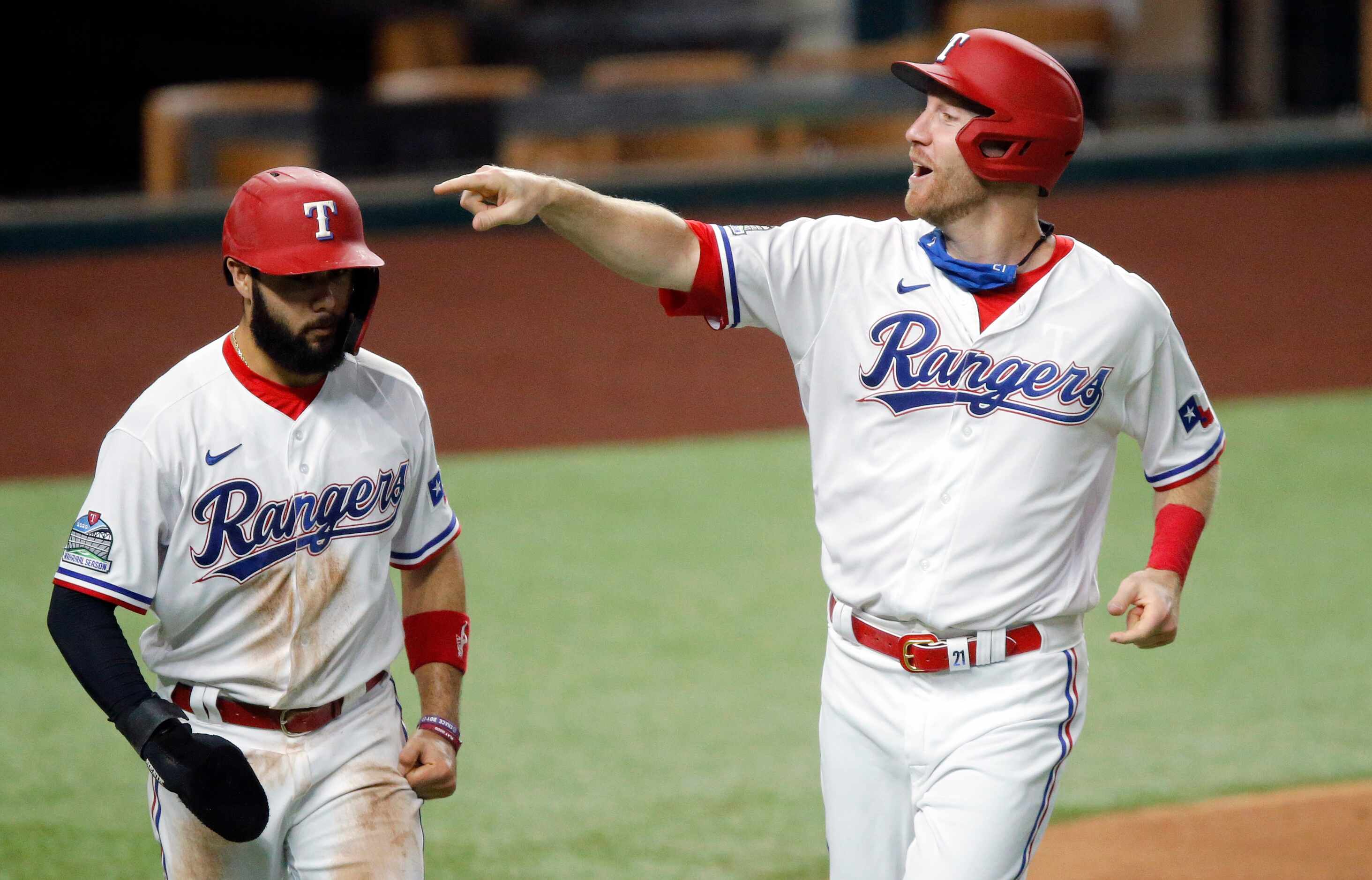 Texas Rangers Todd Frazier (right) scores with Isiah Kiner-Falefa on a single by Nick Solak...